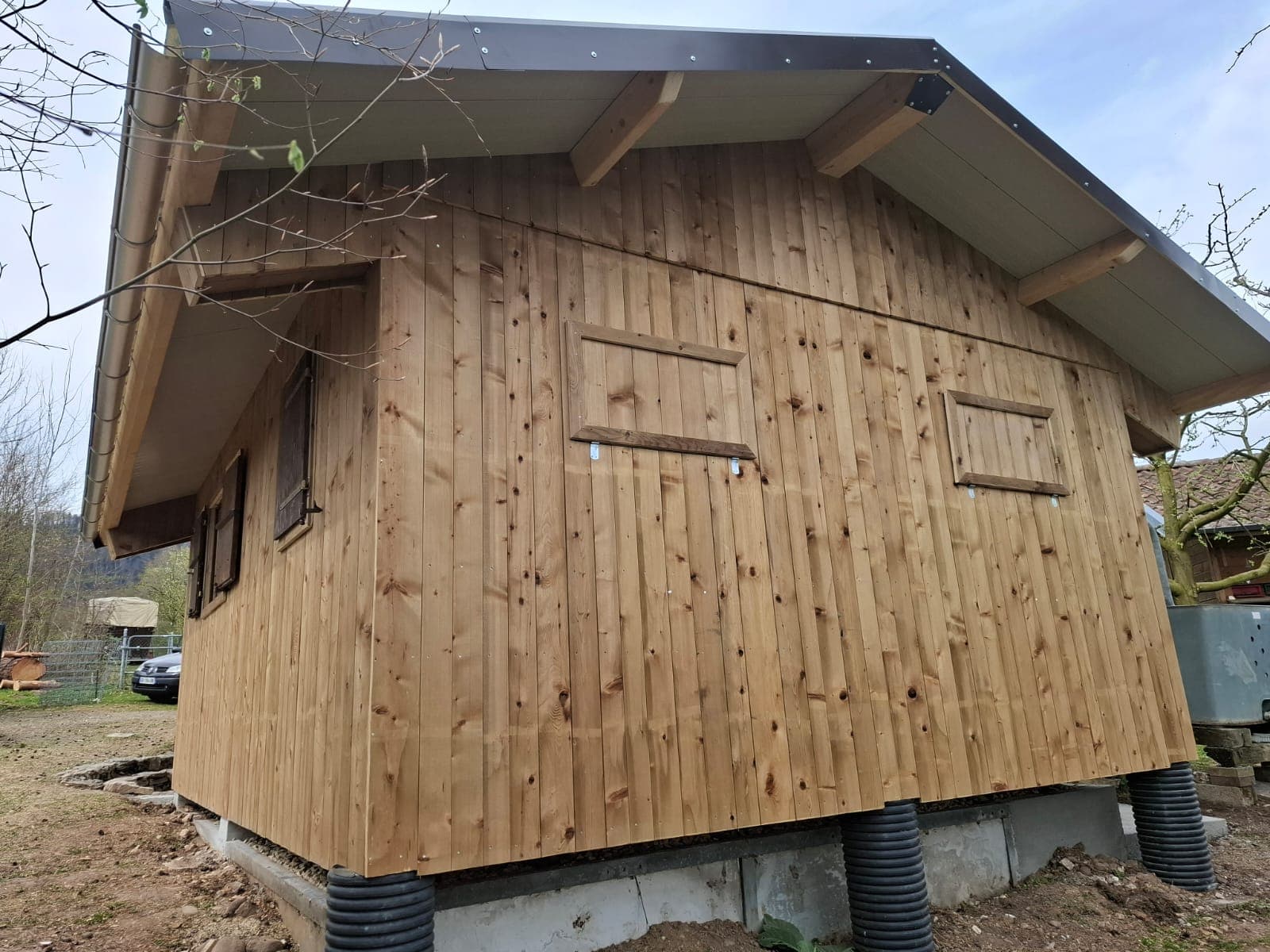 Completed timber building exterior with natural vertical cladding